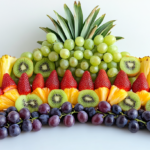 Colorful Rainbow Fruit Kabobs With Strawberries, Pineapple, Grapes, And Kiwi On Skewers
